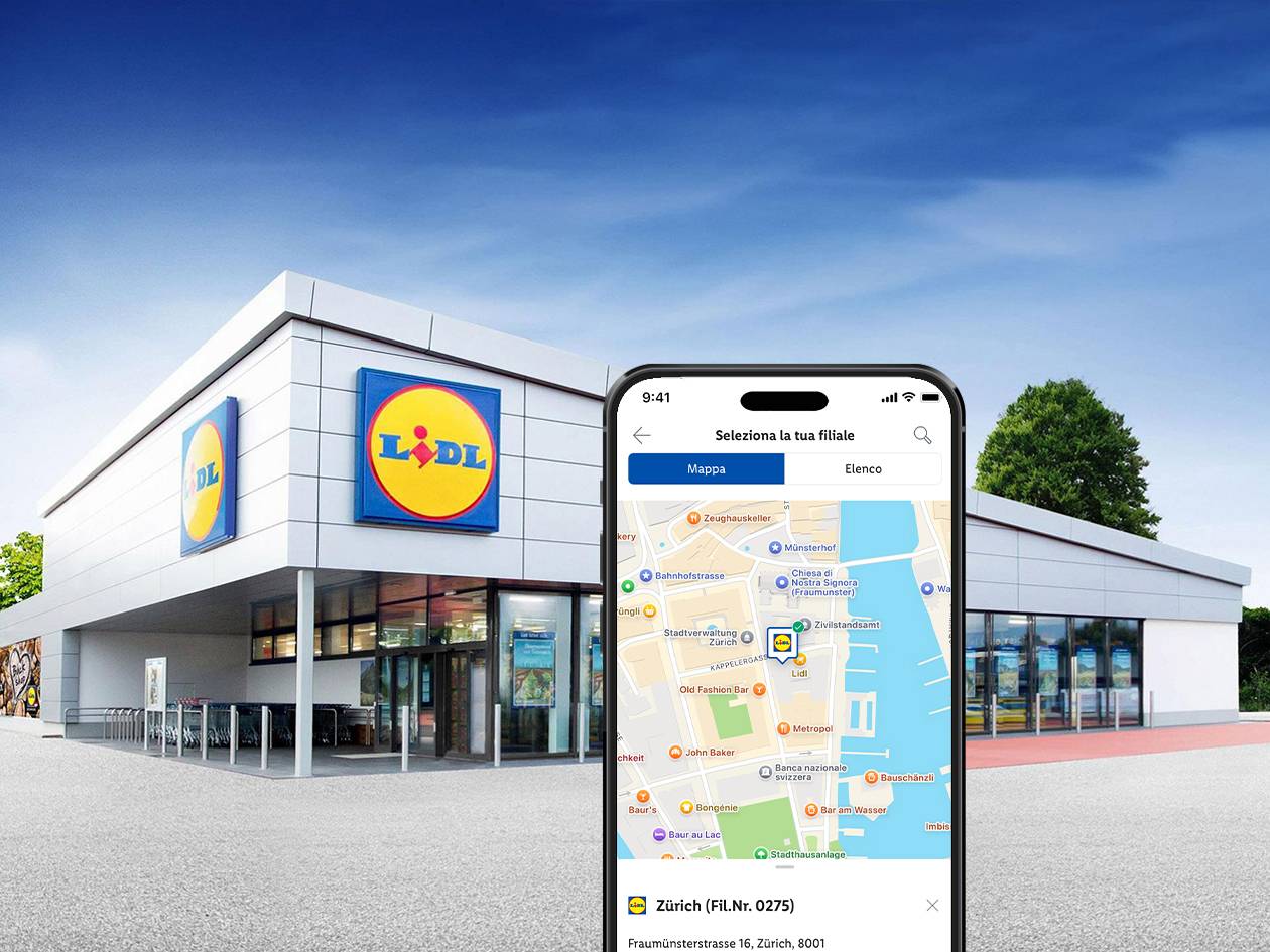 Un edificio di supermercato con uno smartphone che mostra un'app di ricerca filiali.