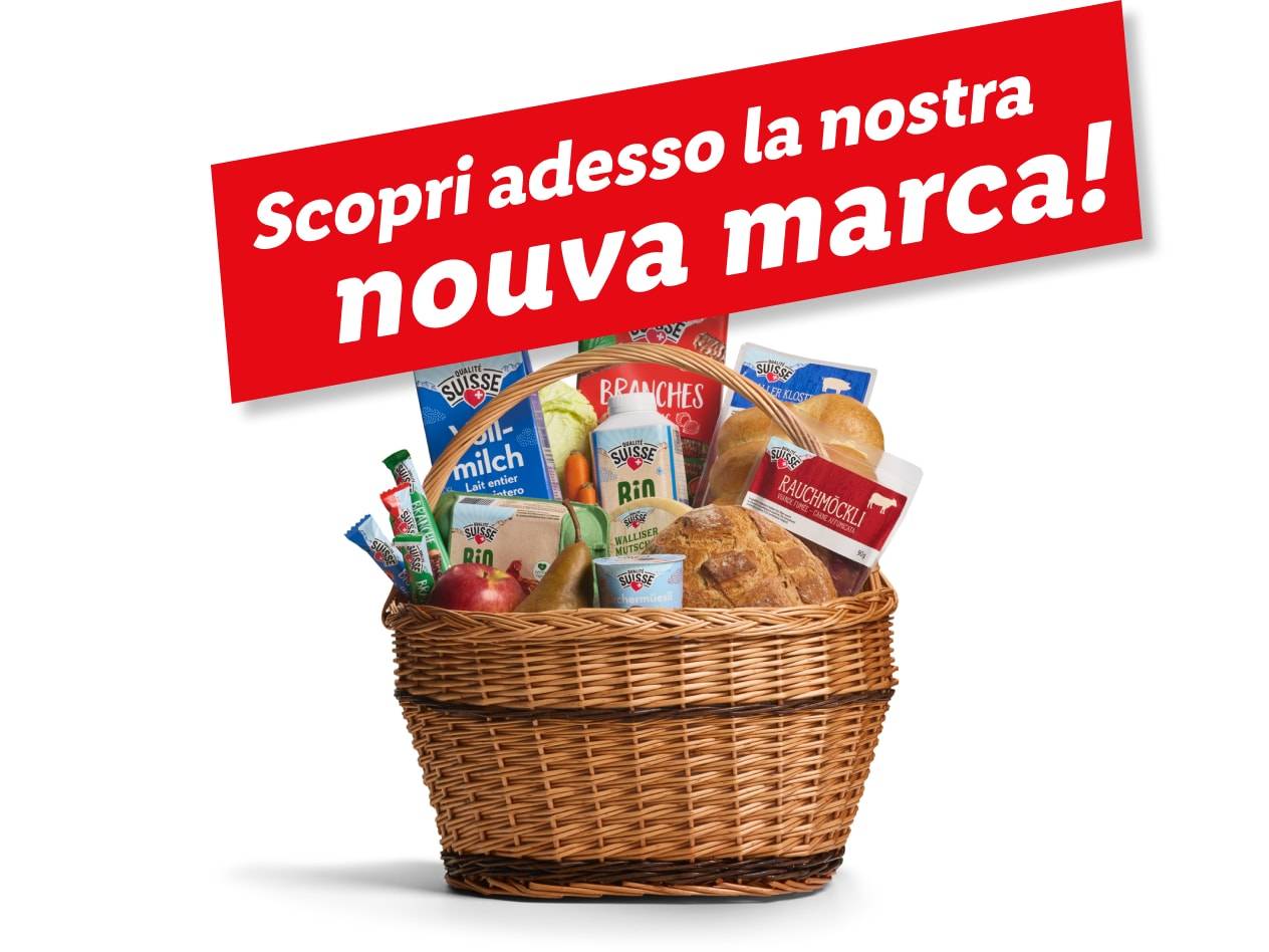Un cesto di prodotti Suissse, tra cui latte, pane e snack, annuncia un nuovo marchio.